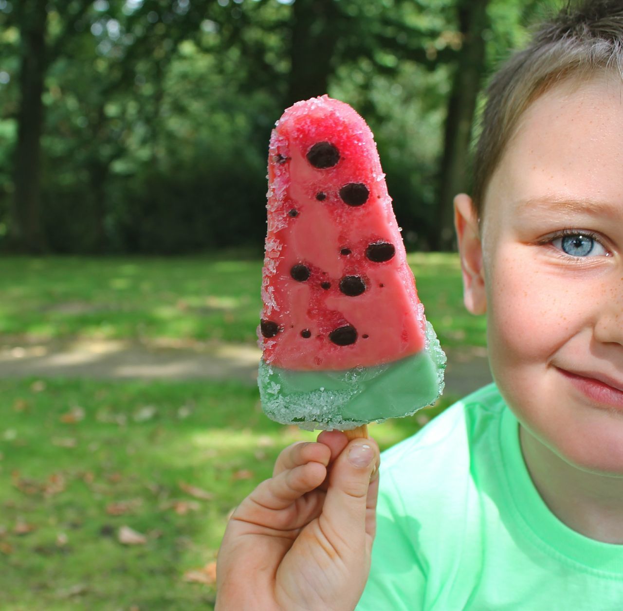 CLOSE-UP PORTRAIT OF BOY HOLDING ICE CREAM