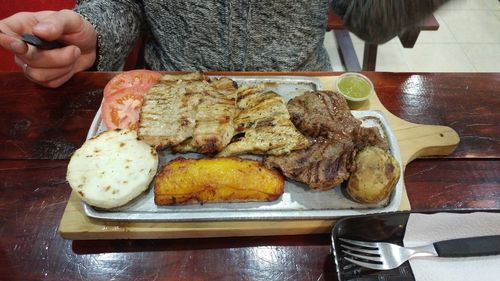 Close-up of man preparing food on table