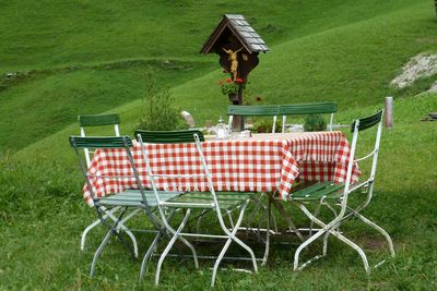 Chairs on table in lawn