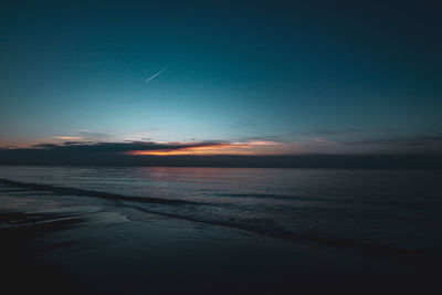 Scenic view of sea against sky at sunset