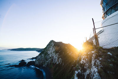 Scenic view of sea against clear sky during sunset