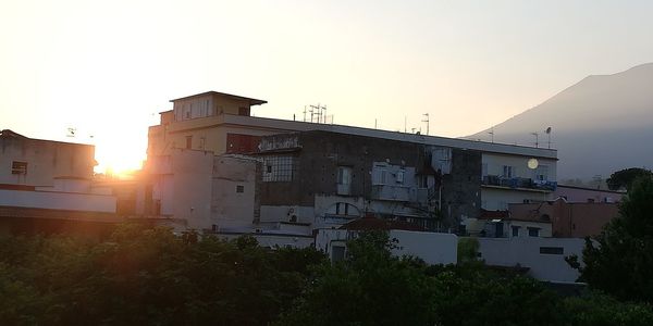 Buildings against sky during sunset