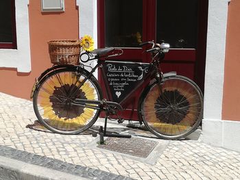 Bicycle wheel against building