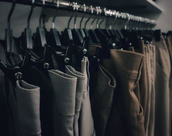 Close-up of clothes hanging at store
