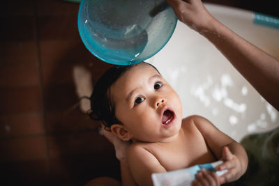 Portrait of cute baby girl in bathroom