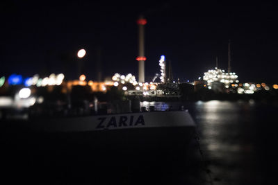 View of illuminated harbor at night