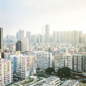 High angle view of buildings in city against sky