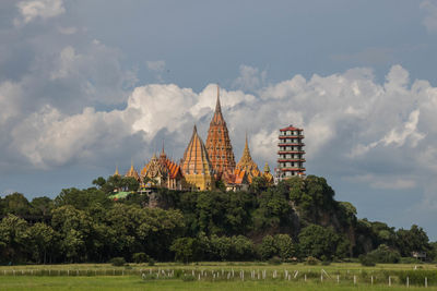 Panoramic view of temple and building against sky