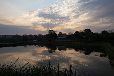 Scenic view of lake against sky during sunset