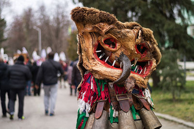 Man wearing costume on footpath