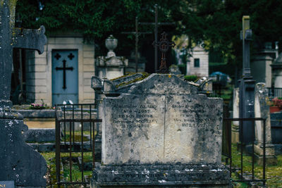 View of cemetery against built structure