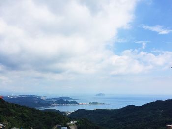 Scenic view of sea against cloudy sky