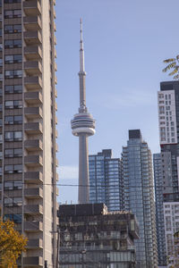 View of communications tower in city