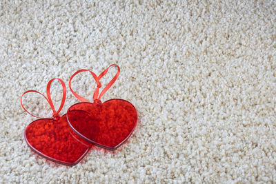 High angle view of heart shape on sand