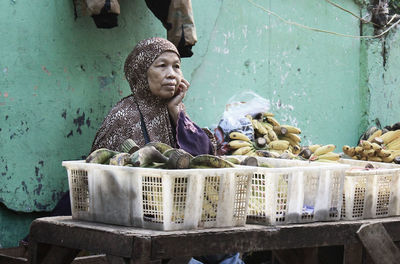 Woman selling bananas in market