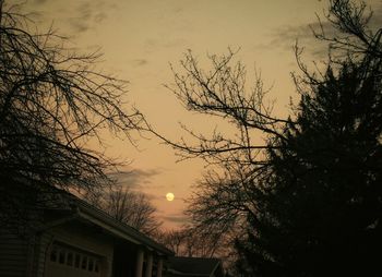 Low angle view of built structure against sky at sunset