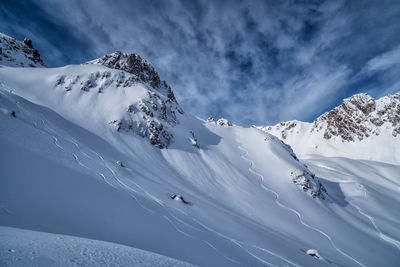 Scenic view of snowcapped mountains against sky