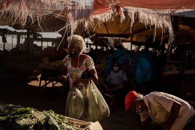 Rear view of girl in market