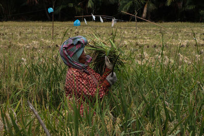 Woman in basket on field