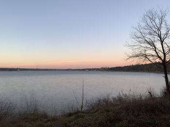 Scenic view of lake against sky during winter