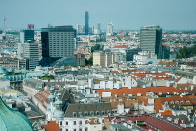 High angle view of buildings in city against clear sky