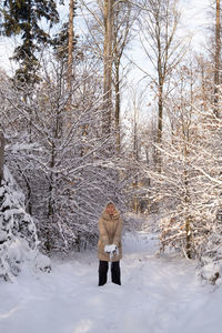 Full length of person on snow covered land