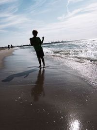 Woman standing on beach