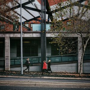 People walking in front of building