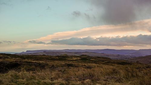 Scenic view of landscape against sky during sunset