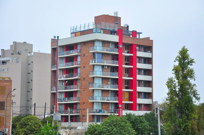 Low angle view of buildings against clear sky