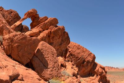 Rock formation on land against clear sky