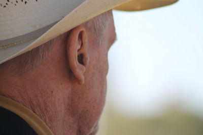 Close-up portrait of man against blurred background