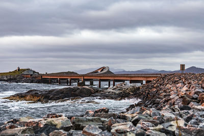 Built structure on beach against sky