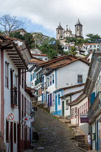 Buildings in town against sky