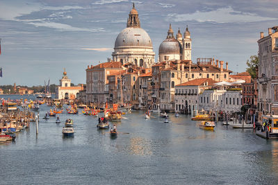 Venice, italy - boats sailing in the grand canal and basilica santa maria della salute