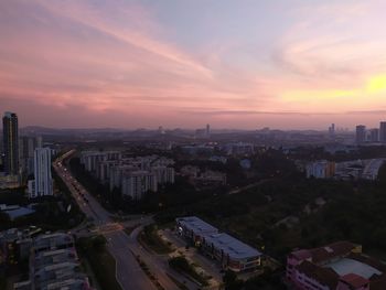 High angle view of buildings against sky during sunset