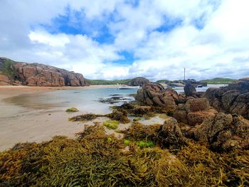 Scenic view of bay against sky