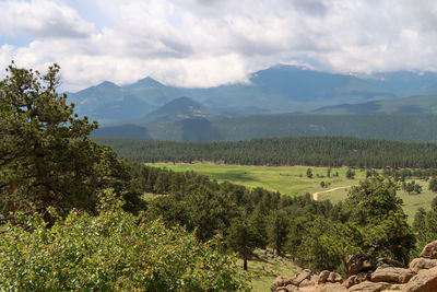 Scenic view of landscape and mountains against sky