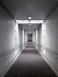 Empty walkway along walls
