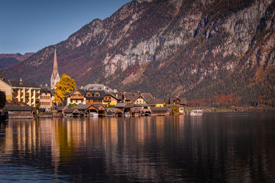 Panoramic view of lake and buildings against sky