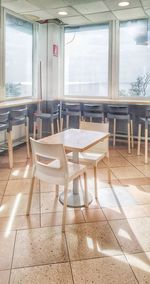 Empty chairs and table in restaurant