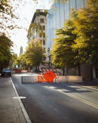 Street by buildings in city