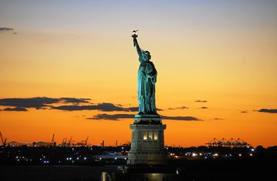 Statue of liberty against sky during sunset