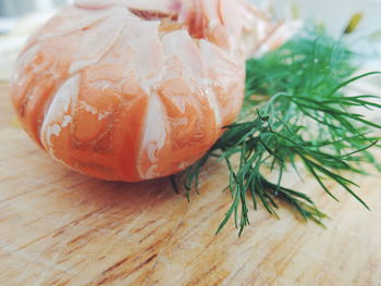 Close-up of crayfish by herbs on table