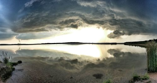 Scenic view of lake against sky during sunset