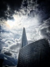 Low angle view of building against cloudy sky