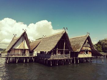 Gazebo by sea against sky