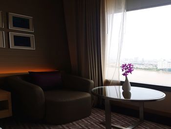Flower vase on table at home
