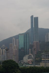 Modern buildings against sky in city