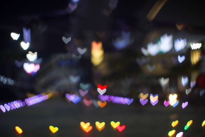Defocused image of illuminated lights at night